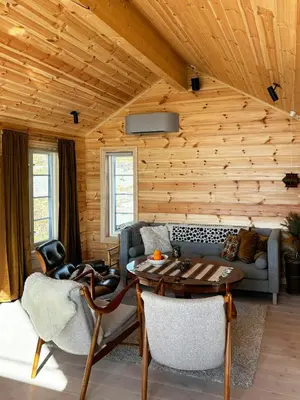 a living room with a couch and a table at Mountain Cabin With Panoramic Views In Valdres in Etnedal