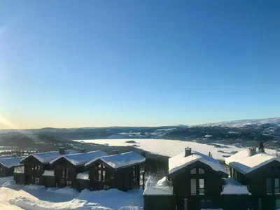 a group of houses in the snow with snow at Apartment With Panoramic Views In Beitostølen in Beitostøl
