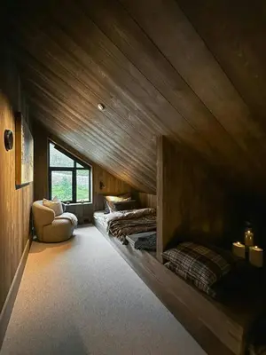 a room with two beds in a wooden room at Modern Mountain Cabin With Views In Hovden in Hovden