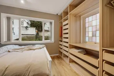 a bedroom with a bed and a window at THIS IS BERGEN, 2 min walk to everything in Bergen