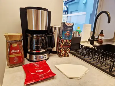 a counter top with a coffee maker and a coffee maker at Brand New & High-End 3 Bedrooms 2 Bathrooms Central Apartment in Bergen