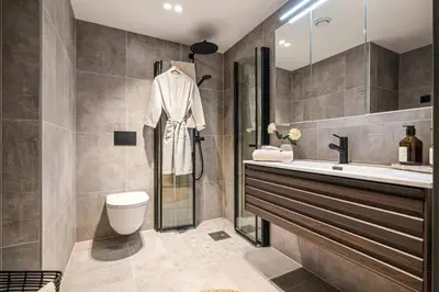 a bathroom with a sink toilet and a shower at Brand New & High-End 3 Bedrooms 2 Bathrooms Central Apartment in Bergen