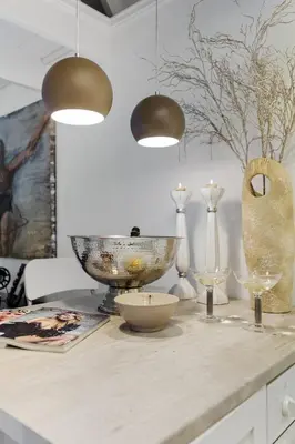 a table with a bowl and vases on it at Lysthuset den lille villa - authentic wodden house in Bergen