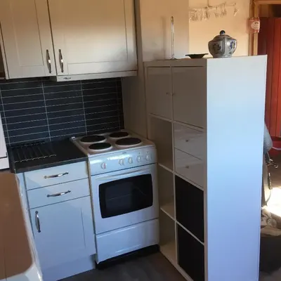 a kitchen with a white stove and a refrigerator at Rauland Hytteutleige in Rauland