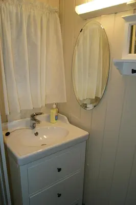 a bathroom with a sink and a mirror at Rauland Hytteutleige in Rauland