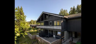 an aerial view of a black house at Hafjell Ski-in Ski-Out in Øyer