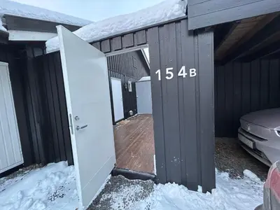 an open garage door with snow on top of it at Hafjell Ski-in Ski-Out in Øyer