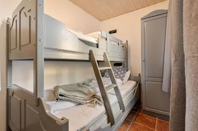 a bedroom with two bunk beds in a room at Trysilfjell 752E by Vacation Trysil in Trysil