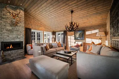 a living room with a couch and a fireplace at The Nordic Retreat - Stryn in Stryn