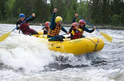 a group of people in a raft on a river at Alpingrenda 38B by Vacation Trysil in Trysil