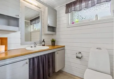 a bathroom with a sink and a toilet at Kvila in Tingvoll