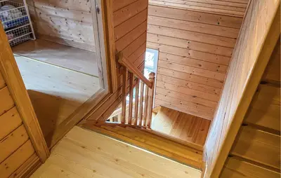an overhead view of a staircase in a wooden cabin at Gorgeous Home In Leinøy With House Sea View in Fosnavåg