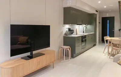 a living room with a large flat screen tv on the wall at Beautiful Home In Bjorli in Bjorli