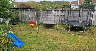 a playground with a trampoline and a swing at Comfortable apartment near the city center and nature