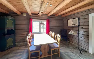 a dining room with a white table and chairs at 3 Bedroom Cozy Home In Mesnali in Mesnali