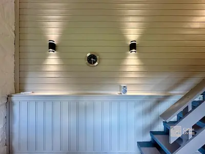 a wall with two lights on it with stairs at Spacious cabin in Hemsedal with sauna, near slopes in Hemsedal