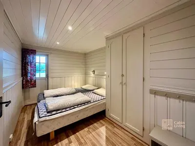 a small bedroom with a bed in a room at Spacious cabin in Hemsedal with sauna, near slopes in Hemsedal