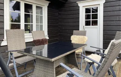 a black table and chairs on a patio at Gorgeous Home In Bjorli With Wifi in Bjorli