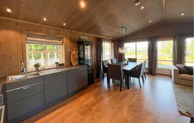 a kitchen and dining room with a table and chairs at Stunning Home In Gålå With Wifi in Gålå