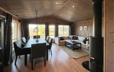 a living room with a table and a couch at Stunning Home In Gålå With Wifi in Gålå