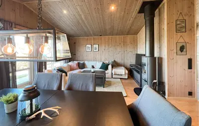 a living room with a table and a couch at Stunning Home In Gålå With Wifi in Gålå
