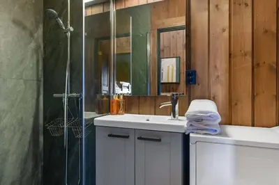 a bathroom with a sink and a shower at Trysilfjell 615 by Vacation Trysil in Trysil