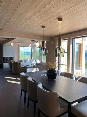 a dining room with a table and chairs at Exclusive cottage on Geilo in Hol