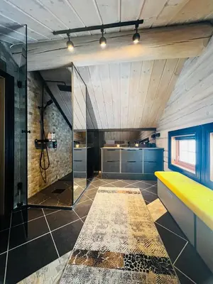 a bathroom with a shower and a yellow bench at Cabin in Kvamskogen in Kvam