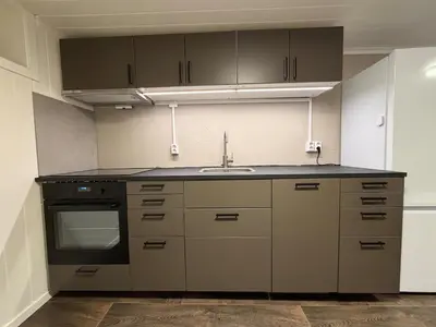 a kitchen with a sink and a stove at Ny leilighet i Stjørdal in Stjoerdal