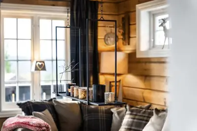 a living room with a couch and a window at Trysilfjell hytteområde 922 by Vacation Trysil in Trysil