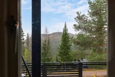 a view of a mountain from a window at Fageråsen 209 by Vacation Trysil in Trysil