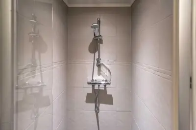 a bathroom with a shower with a shower head at Trysilfjellet Nord 985A in Trysil