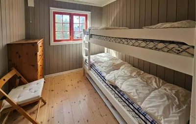 two bunk beds in a room with a window at Gorgeous Home In Eggedal With Sauna in Eggedal