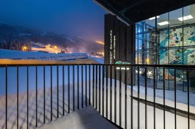a view of a building in the snow at night at Brand new luxury apartment by the slopes, Hemsedal in Hemsedal