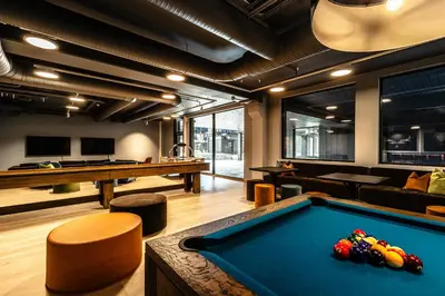 a billiard room with a pool table and a couch at Brand new luxury apartment by the slopes, Hemsedal in Hemsedal