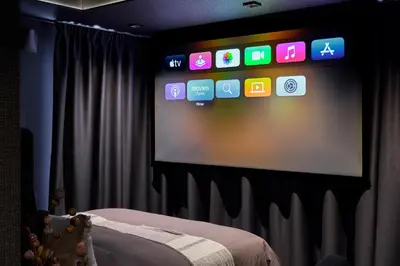 a room with a screen with a bunch of apps at Hideaway Herdla luxurious cabins 15 m above the sea in Herlø