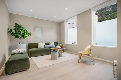 a living room with a couch and a chair at Beautiful 3 room apartment centrally located in Sandviken in Bergen