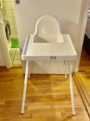 a white high table in a bathroom with a toilet at Riverside family-friendly Mini Penthouse in Trondheim