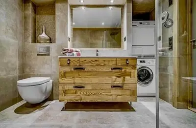a bathroom with a toilet and a sink and a washing machine at Flat With Panoramic Views Of Hallingskarvet in Geilo