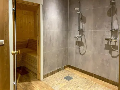 a bathroom with a shower and a walk in shower at Flat With Panoramic Views Of Hallingskarvet in Geilo