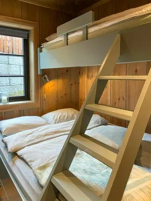 a bunk bed in a bedroom with a bunk bed in it at Flat With Panoramic Views Of Hallingskarvet in Geilo