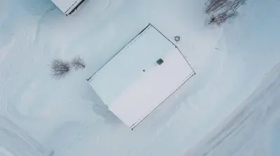 an overhead view of a tennis net in the snow at Cozy Family Cabin Ski centre, shuttle bus in Noresund