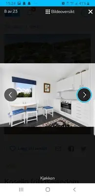 a screenshot of a room with a kitchen with a table at Et golfslag fra Stiklestad Golfklubb in Verdal