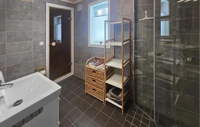a bathroom with a sink and a shower at Cozy Home In Ulnes With Sauna in Ulnes