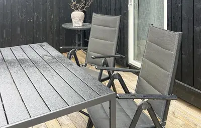 two chairs and a table on a patio at 3 Bedroom Stunning Home In Hovden I Setesdal in Hovden