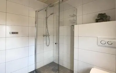 a shower with a glass door in a bathroom at 3 Bedroom Stunning Home In Hovden I Setesdal in Hovden