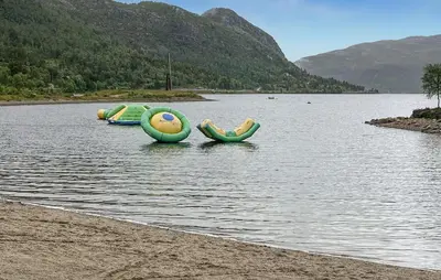 three inflatable boats in the water on a lake at 3 Bedroom Stunning Home In Hovden I Setesdal in Hovden