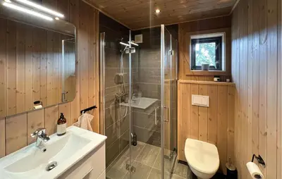 a bathroom with a shower and a sink and a toilet at Amazing Home In Gålå With Sauna in Gålå