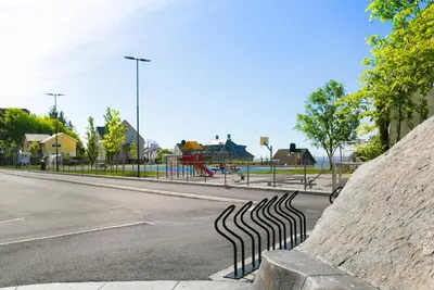 a metal fence on the side of a street at Centrum Apartment in Ålesund
