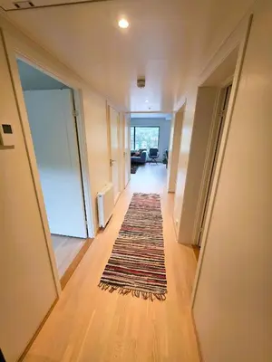 a hallway with a rug on the floor of a house at Nice apartment in the center of Trysil 403 in Trysil